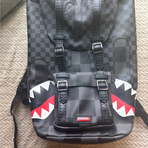 Black Checkered Backpack with Red Accents Sprayground